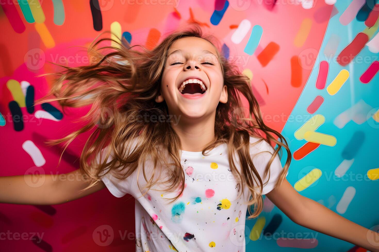 Teenage Girl Expressing Extreme Joy in Colorful Studio Setting photo
