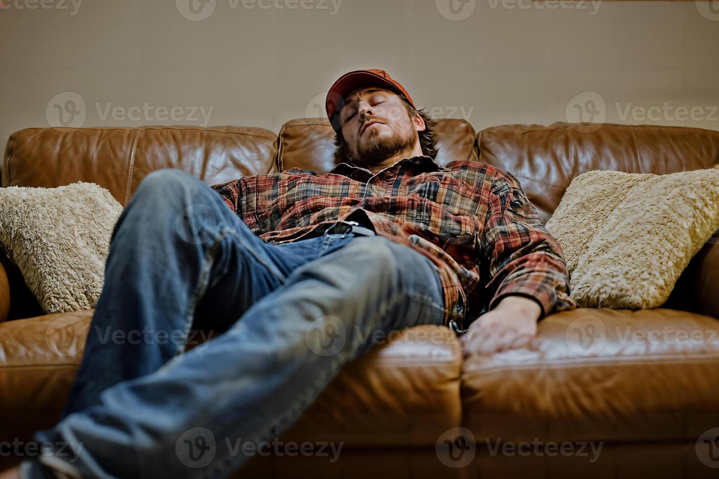 Exhausted Worker Relaxing on Couch After a Long Day at Work photo