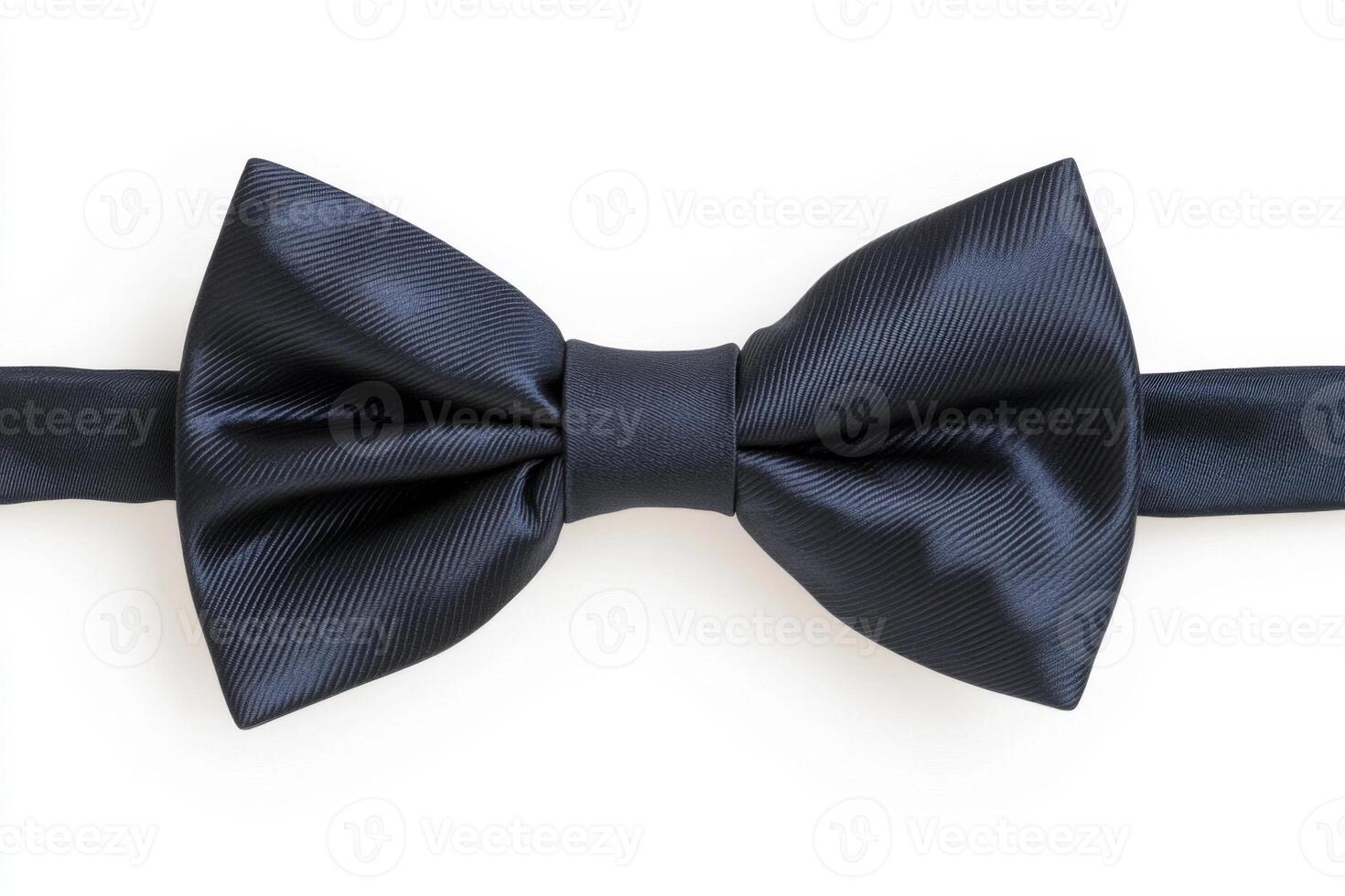 Elegant black bow tie resting on a neutral background, showcasing a smooth texture and classic design, perfect for formal occasions and stylish attire in various settings photo