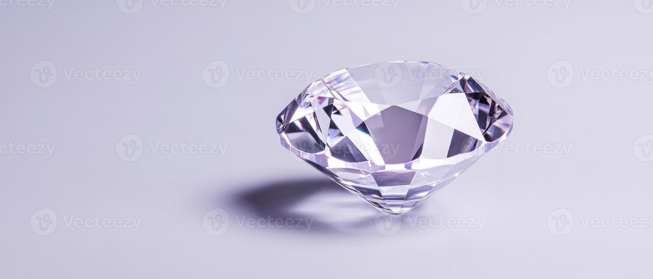 A stunning diamond shines brightly on a muted background, reflecting light beautifully photo
