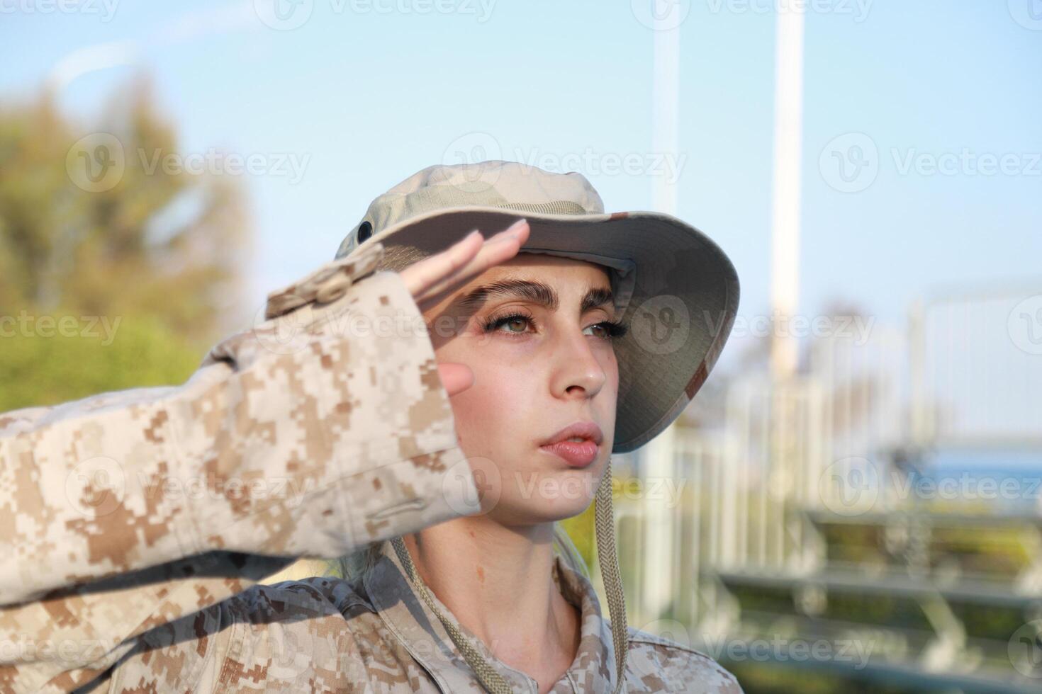 Focused Female Soldier in Action photo