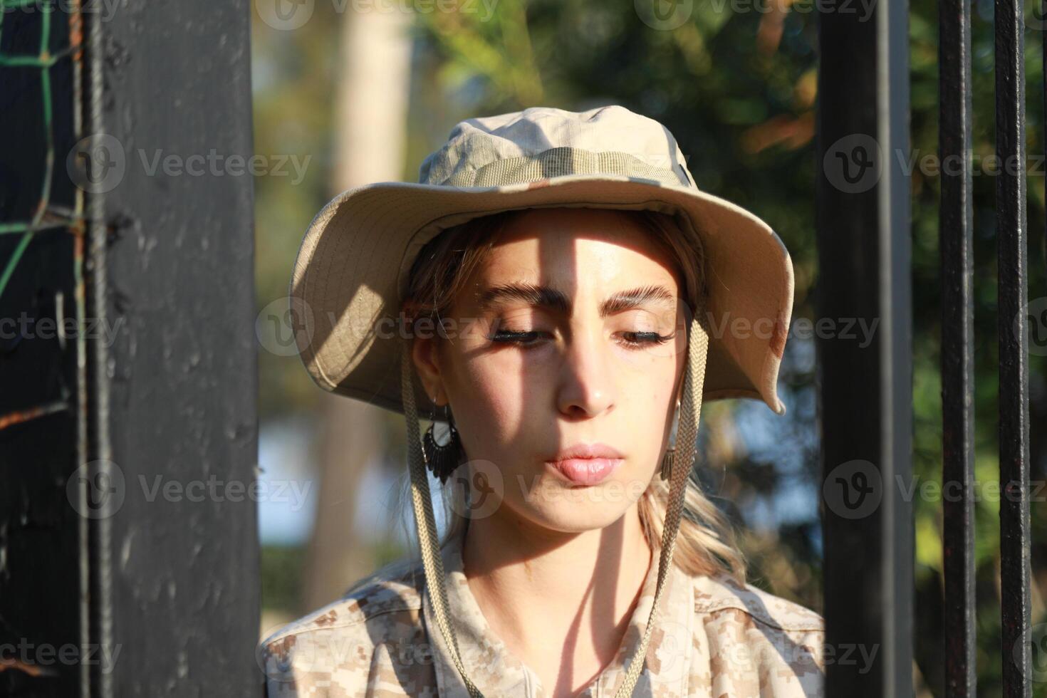 Young Woman Soldier Escaping From Prison photo