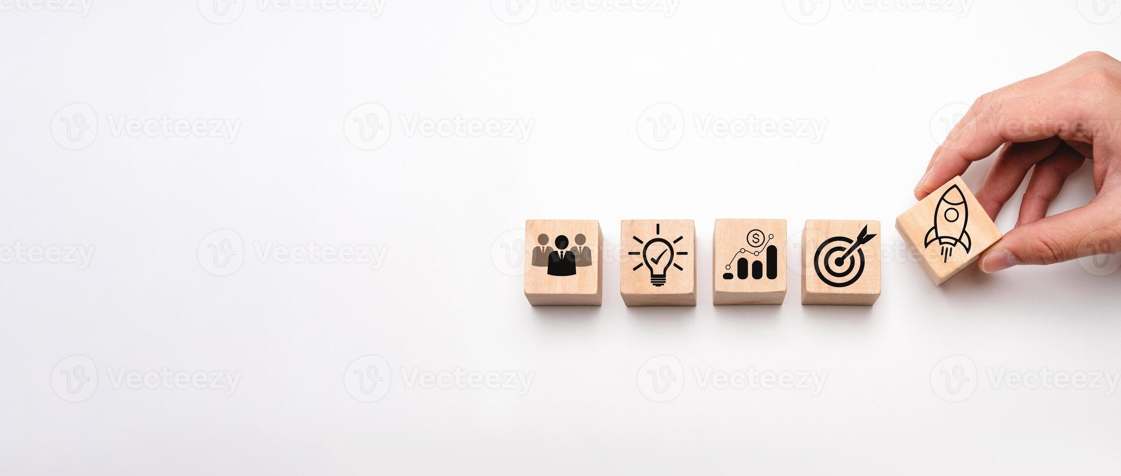 Business Development Concept with Wooden Blocks Depicting Teamwork, Innovation, Financial Growth, Goal Achievement, and Startup Launch Symbols Representing Strategy and Organizational Success photo