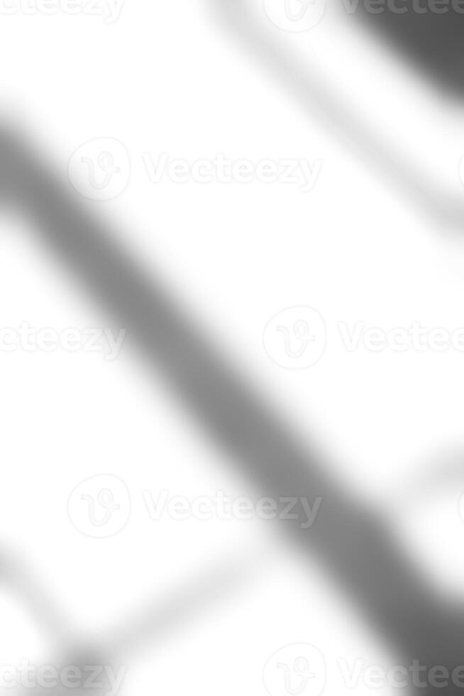 Shadow overlay effect for photo background.Grey drop diagona of light from window on a white wall. Natural light reflection