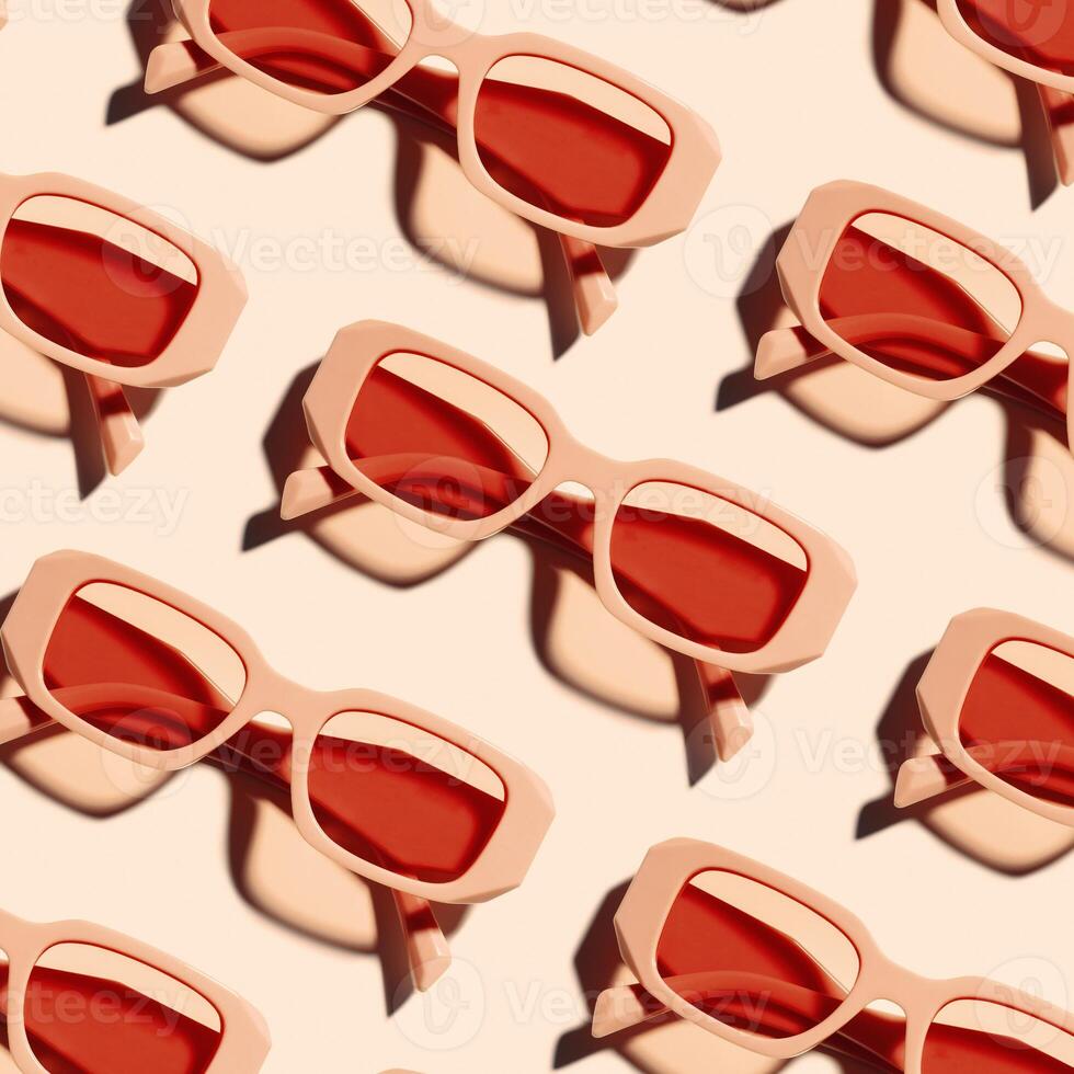 Pattern of pink color sunglasses on pastel pink background at sunlight with shadow. Summer fashion eyeglasses with rose colored glass. Summer vacation, rest concept. Minimal style flat lay, top view photo