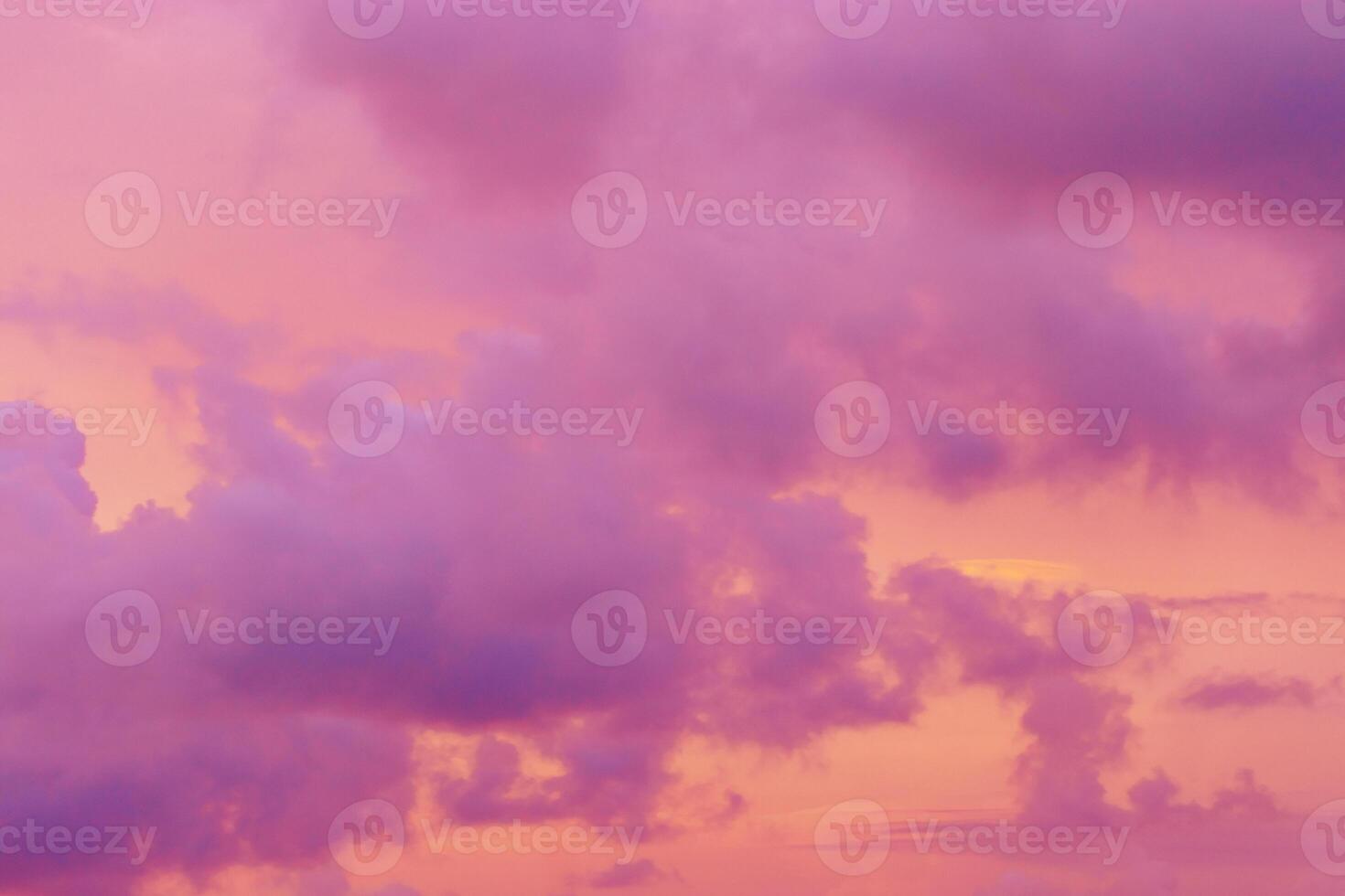 Pastel nature Sunset, purple fluffy clouds on pink colored sky, picturesque landscape pastel color, soft colorful scenery with vanilla sky, beautiful sunlight lighting heaven in bright colors photo