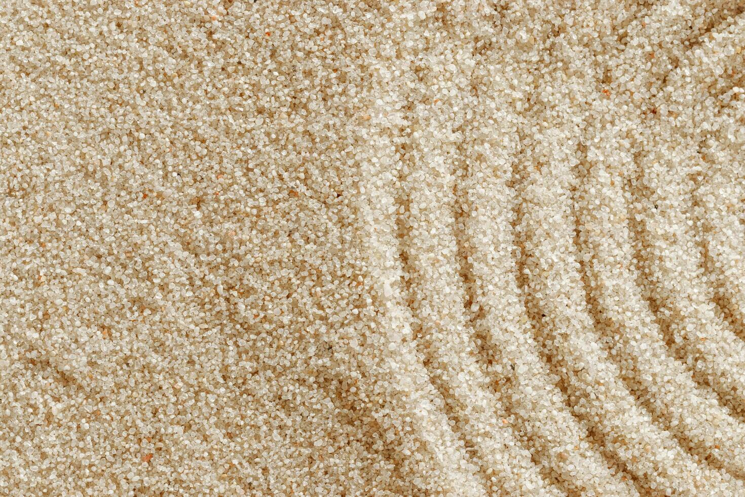 Top view pattern in Japanese Zen Garden with close up concentric circles on sand for meditation and relaxation. Aesthetic minimal sandy background with copy space, beige monochrome neutral tones photo