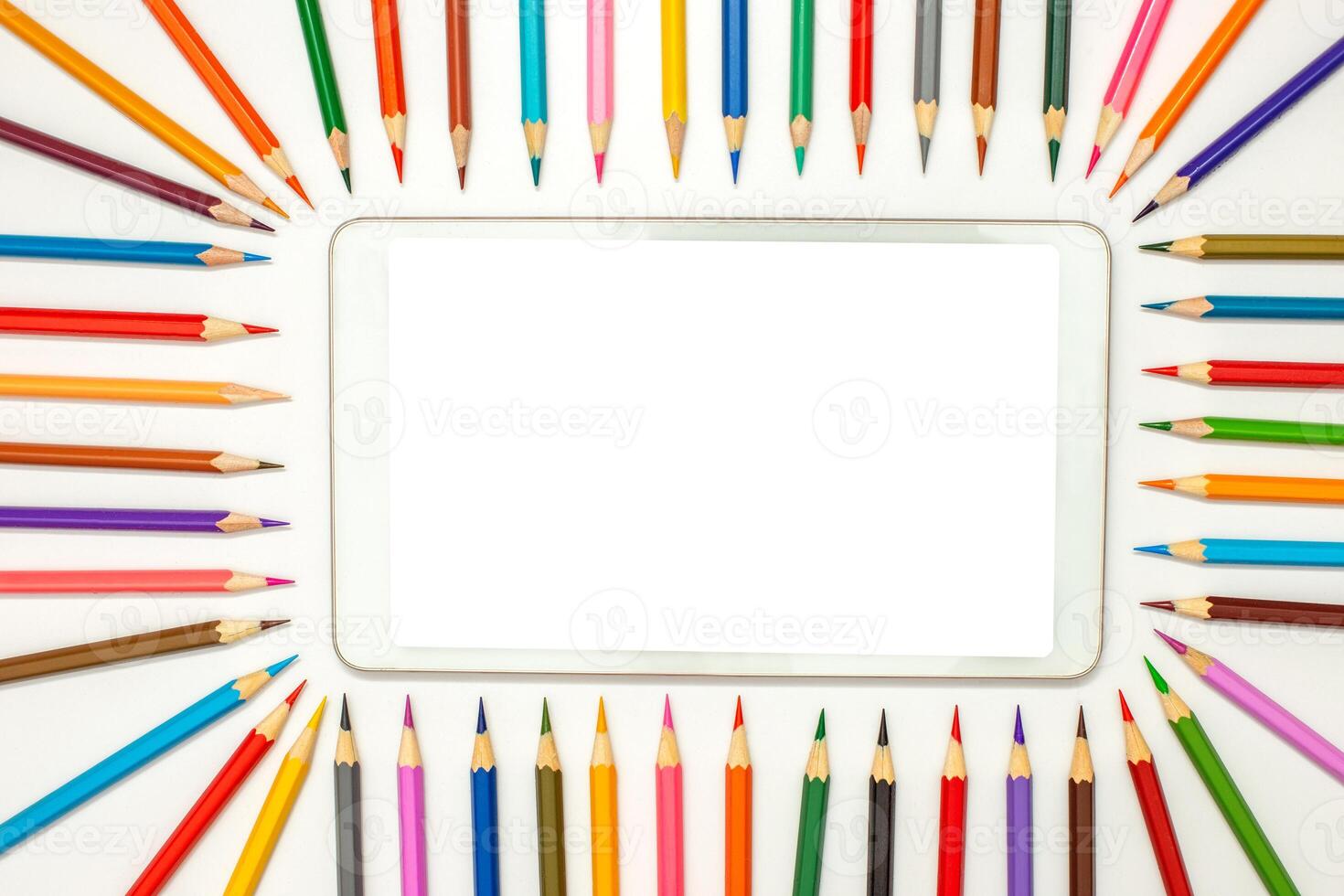 mockup of digital tablet with frame of multicolored pencils photo