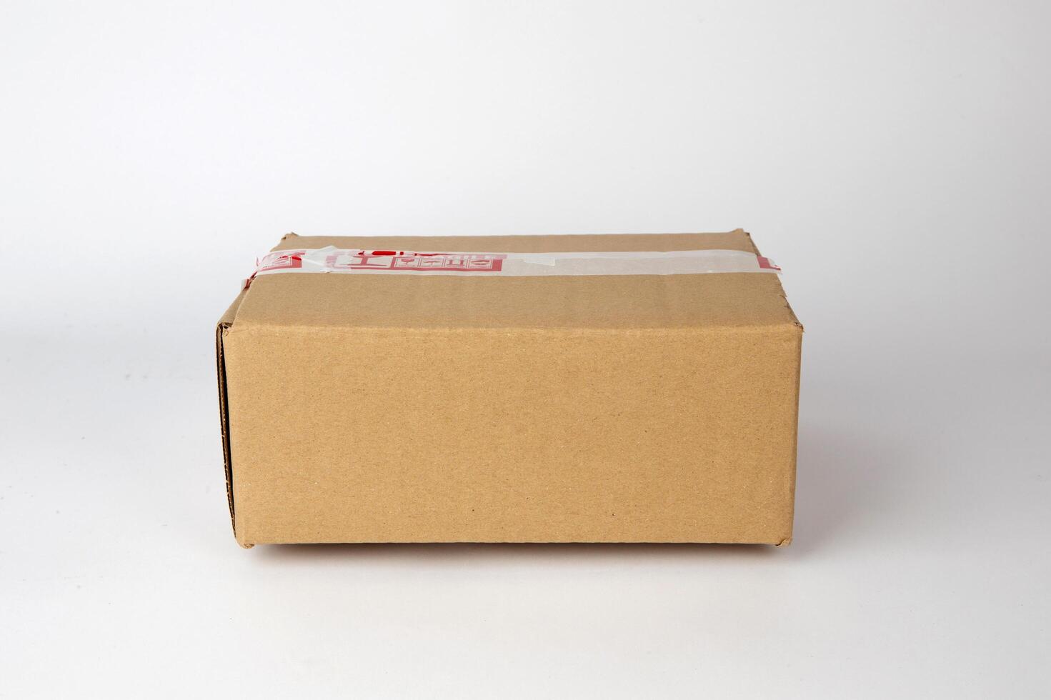 Brown cardboard box isolated on white background photo