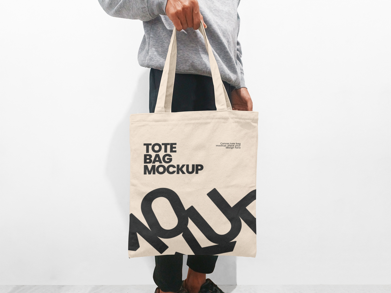 Man holding a tote bag mockup realistic on white background psd