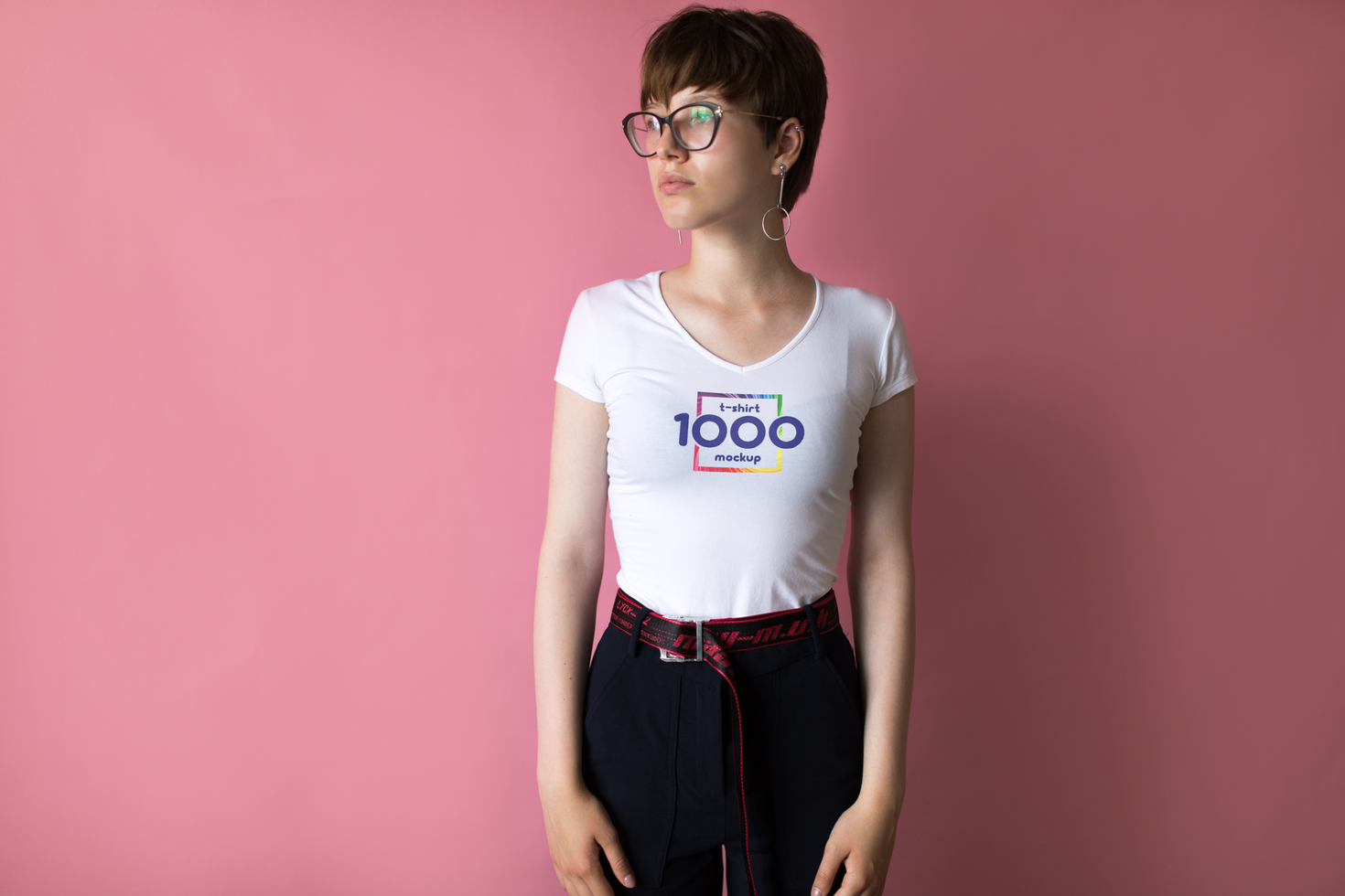 Young Woman in White T-Shirt with Logo Mockup Against Pink Background psd