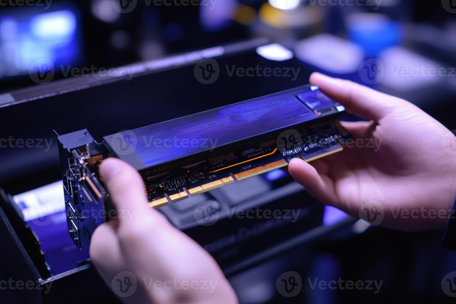 Technician installing new graphics card in desktop computer photo
