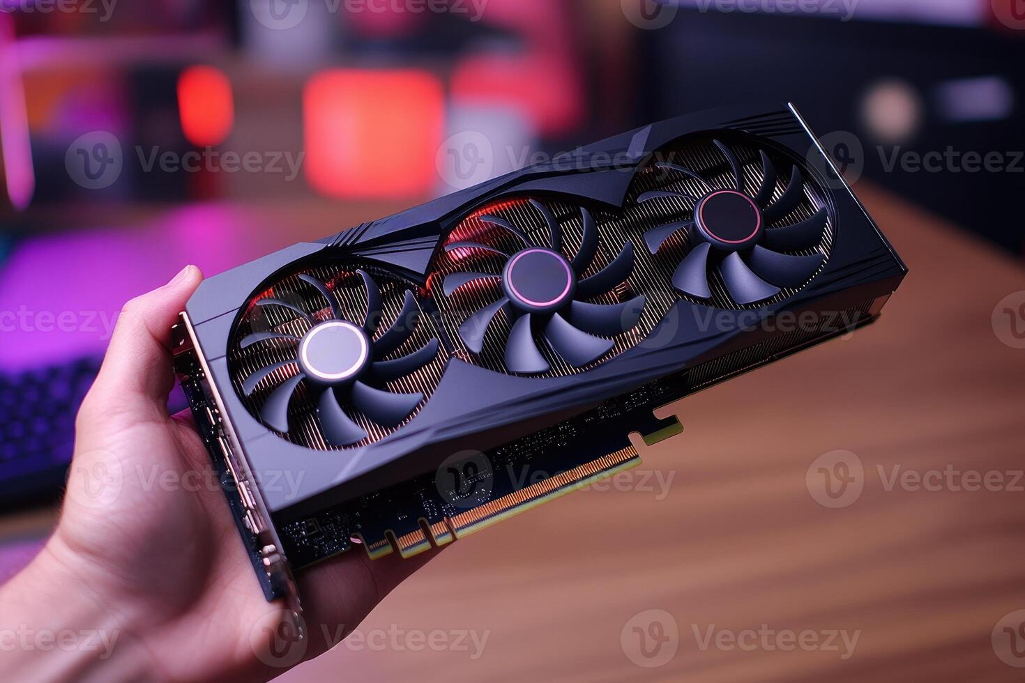 Technician holding powerful new graphics card for desktop computer photo