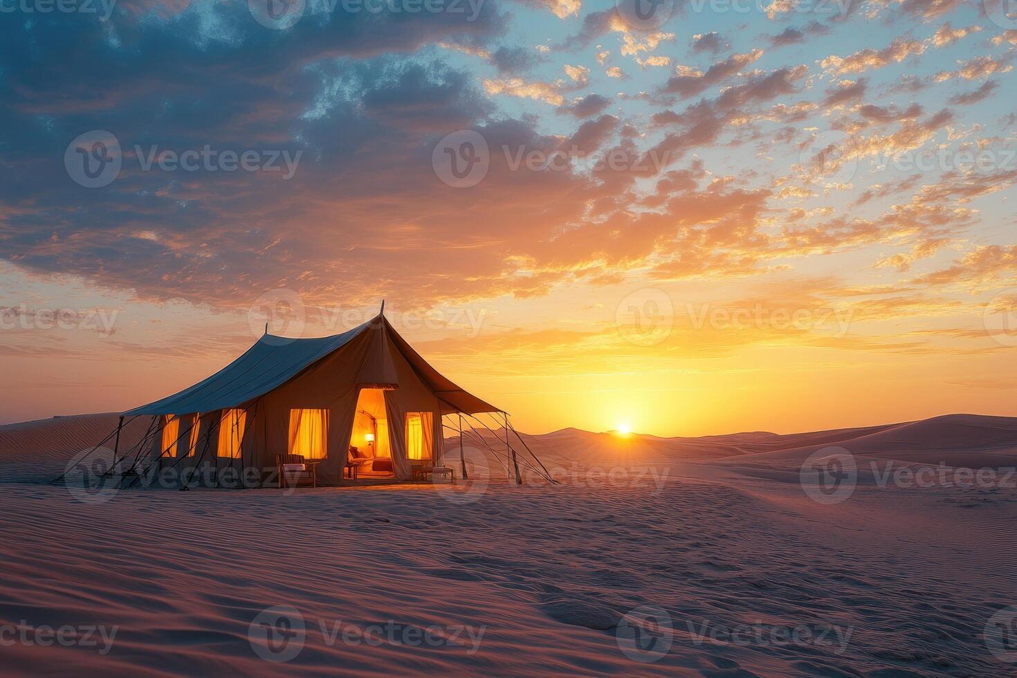 Illuminated tent embracing the warmth of a desert sunset photo