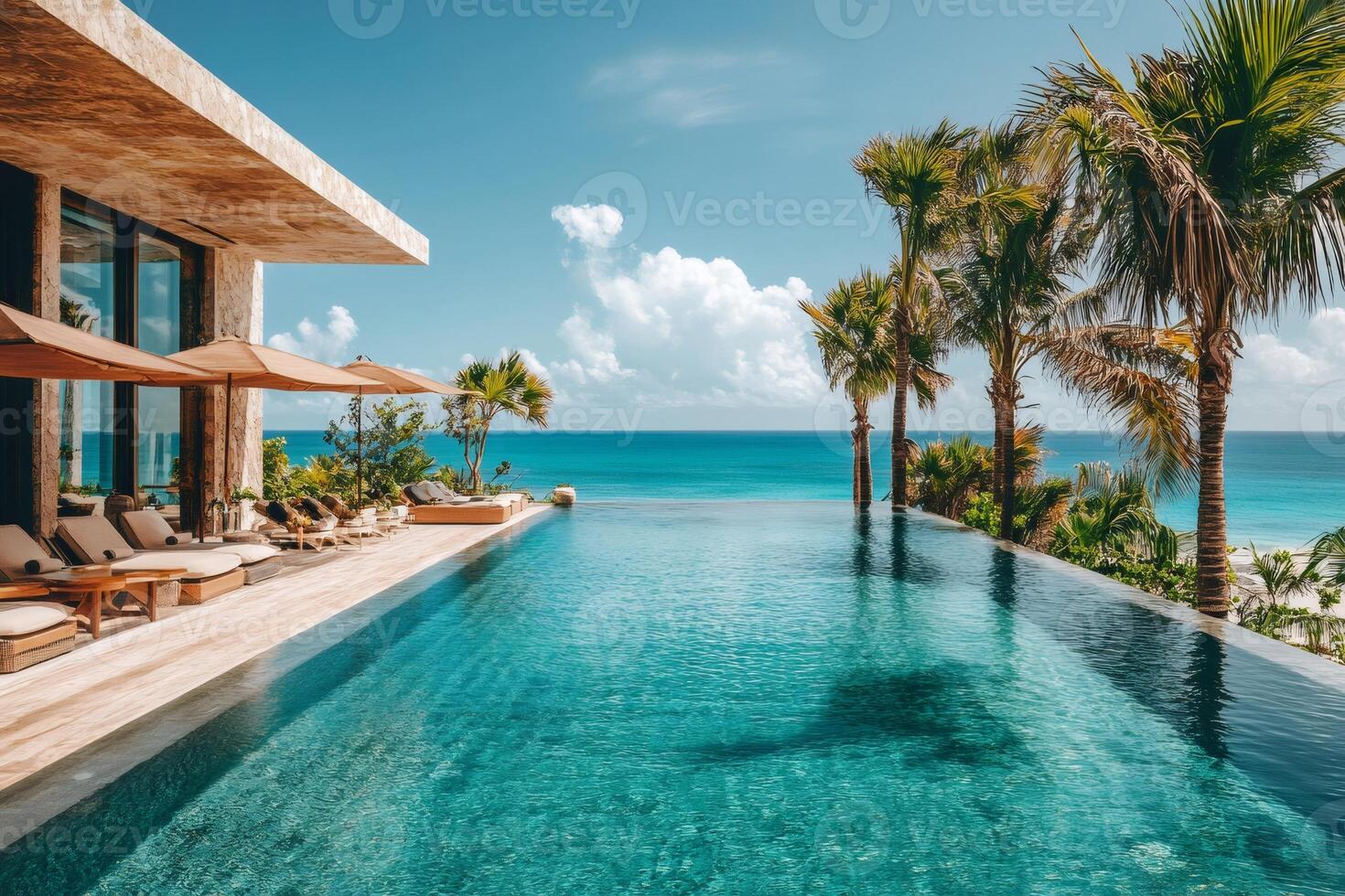 Infinity pool overlooking tropical ocean at luxury resort. photo