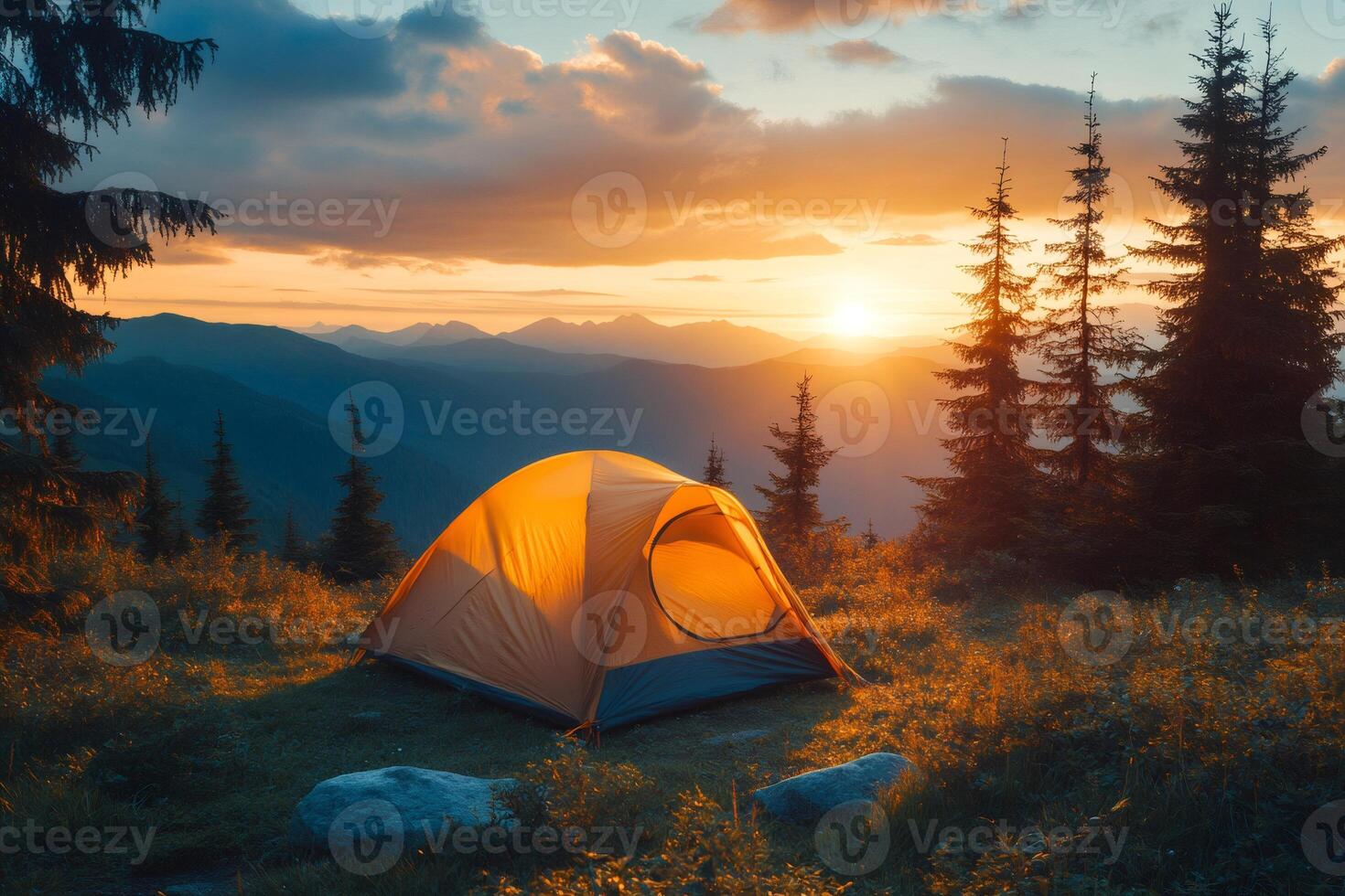 Illuminated tent embraces the golden hour in a breathtaking mountain vista photo