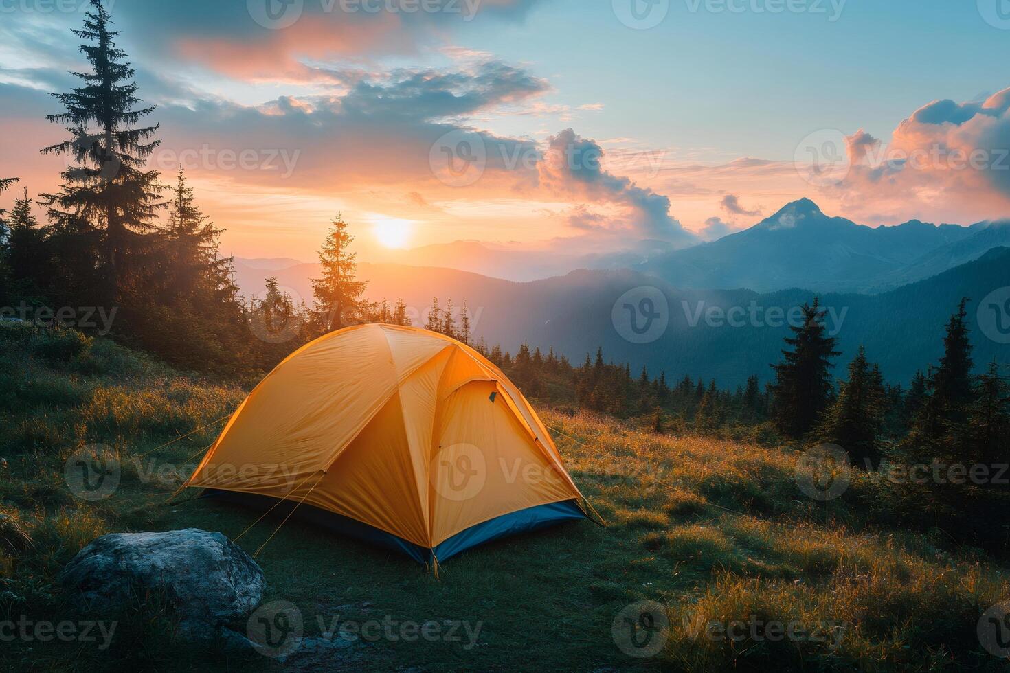 Illuminated tent nestled in tranquil mountain meadow at sunset photo