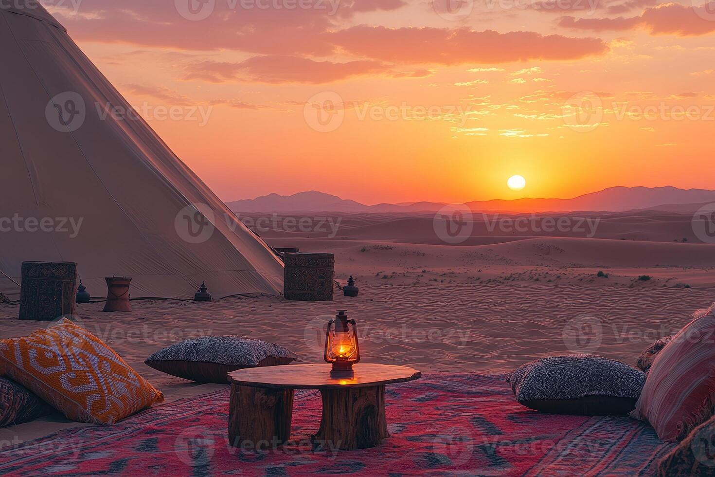 Desert glamping tent with cushions and oil lamp at sunset photo