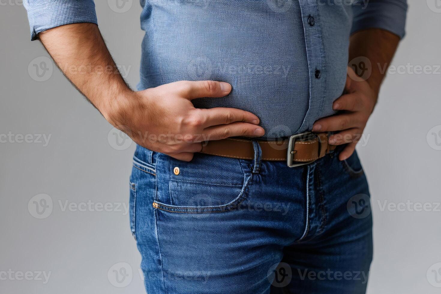Overweight man touching big belly with hands, health problems concept photo