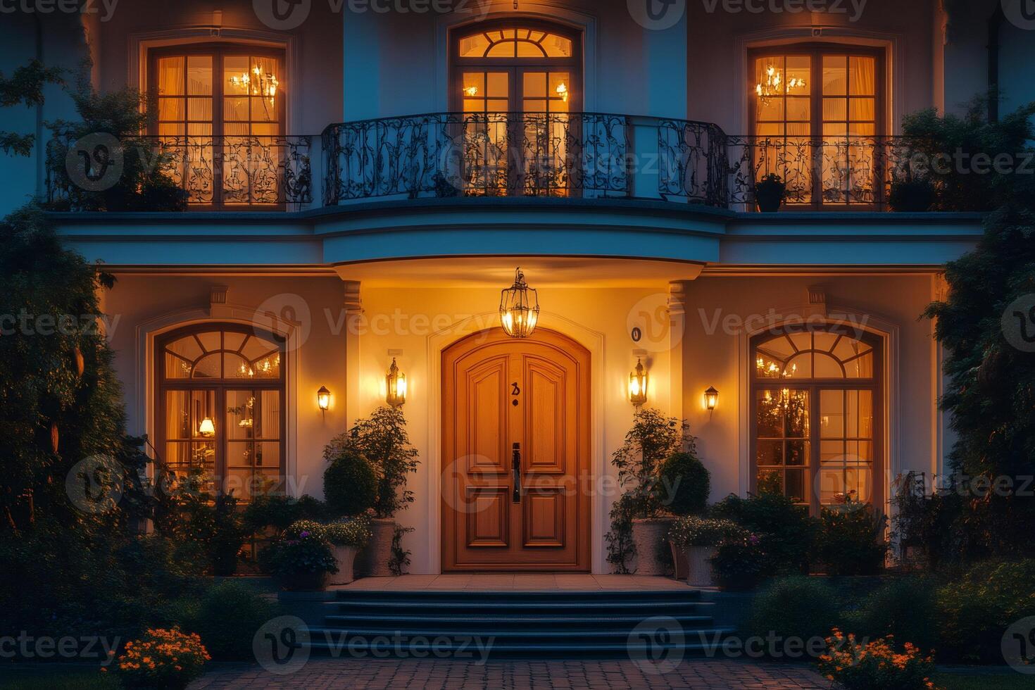 Luxurious mansion illuminated at twilight with elegant wooden door and balcony photo