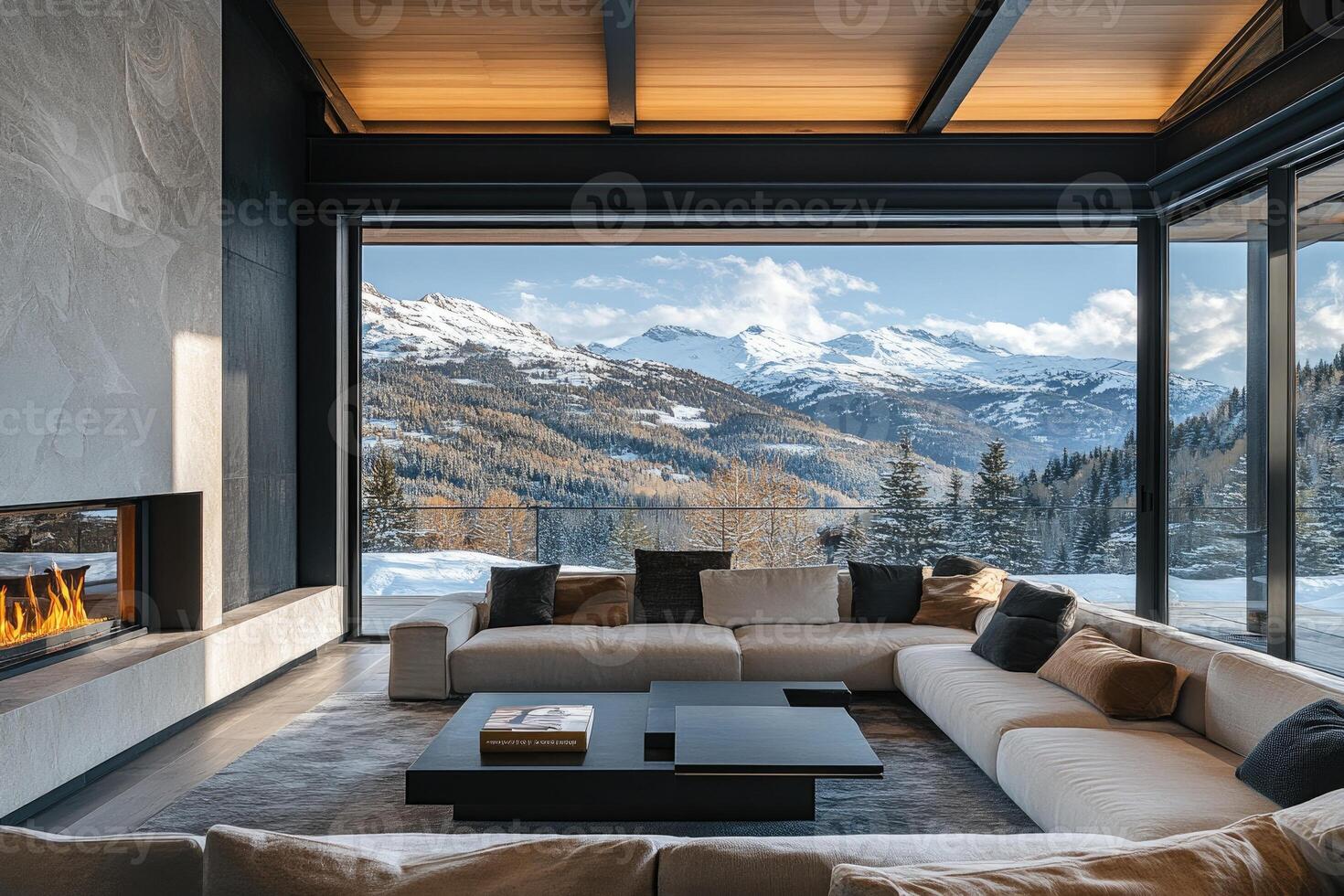 Modern living room overlooking snowy mountain range with fireplace photo