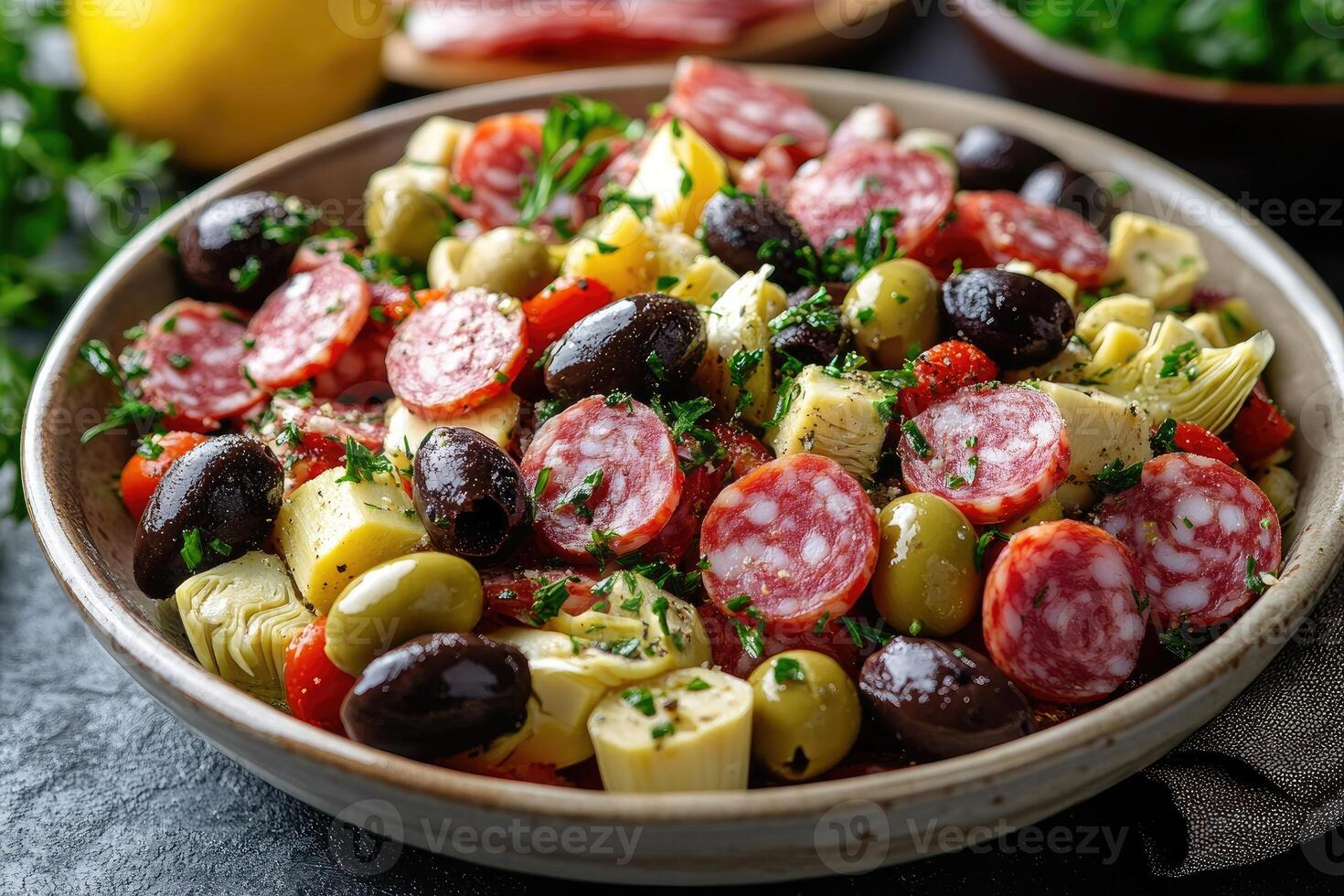 Sliced sausage with artichokes and olives composing a delicious mediterranean salad. photo
