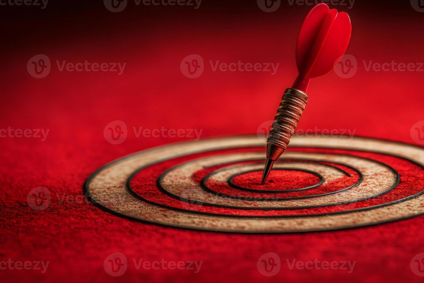 Red dart perfectly hitting the bullseye on target photo