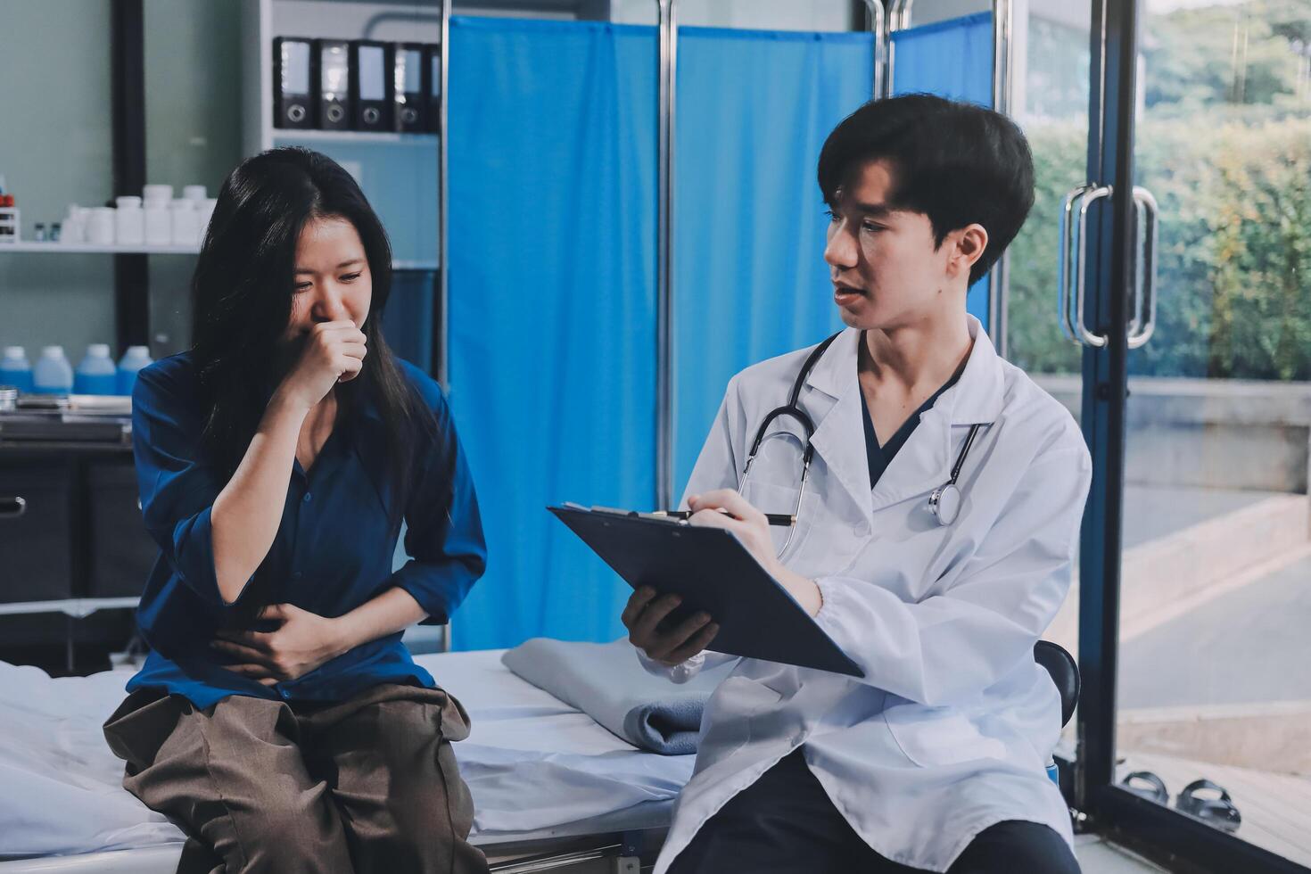 A doctor talking to a patient in a hospital room photo