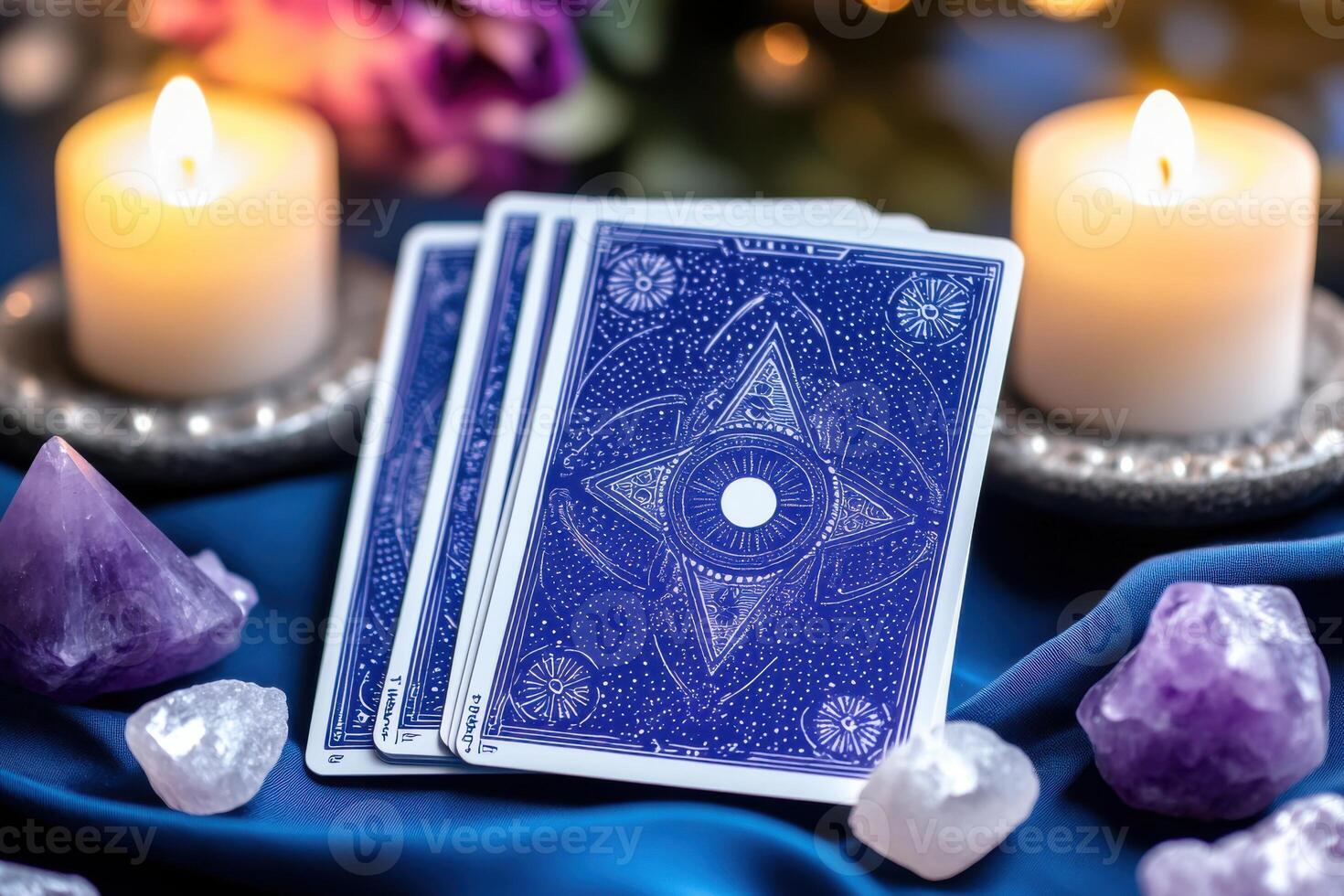 Mystical tarot card reading setup with deep violet fabric, glowing candles, and crystals for spiritual exploration and insight photo