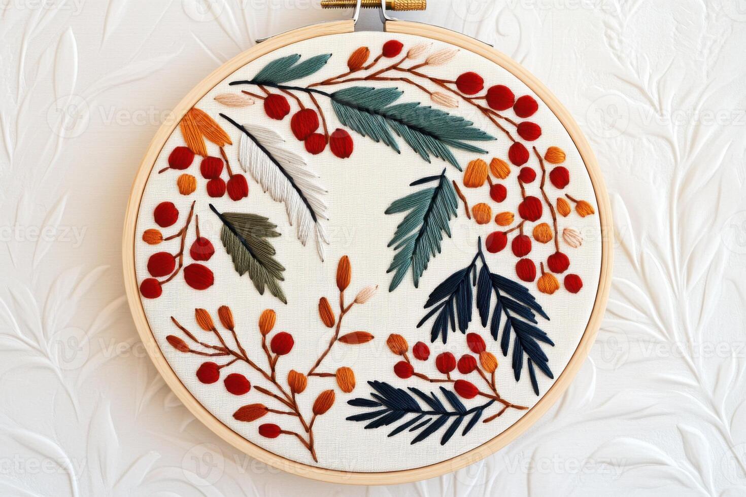 Handmade crewel embroidery wall art featuring intricate nature patterns in warm lighting displayed in an elegant wooden hoop photo