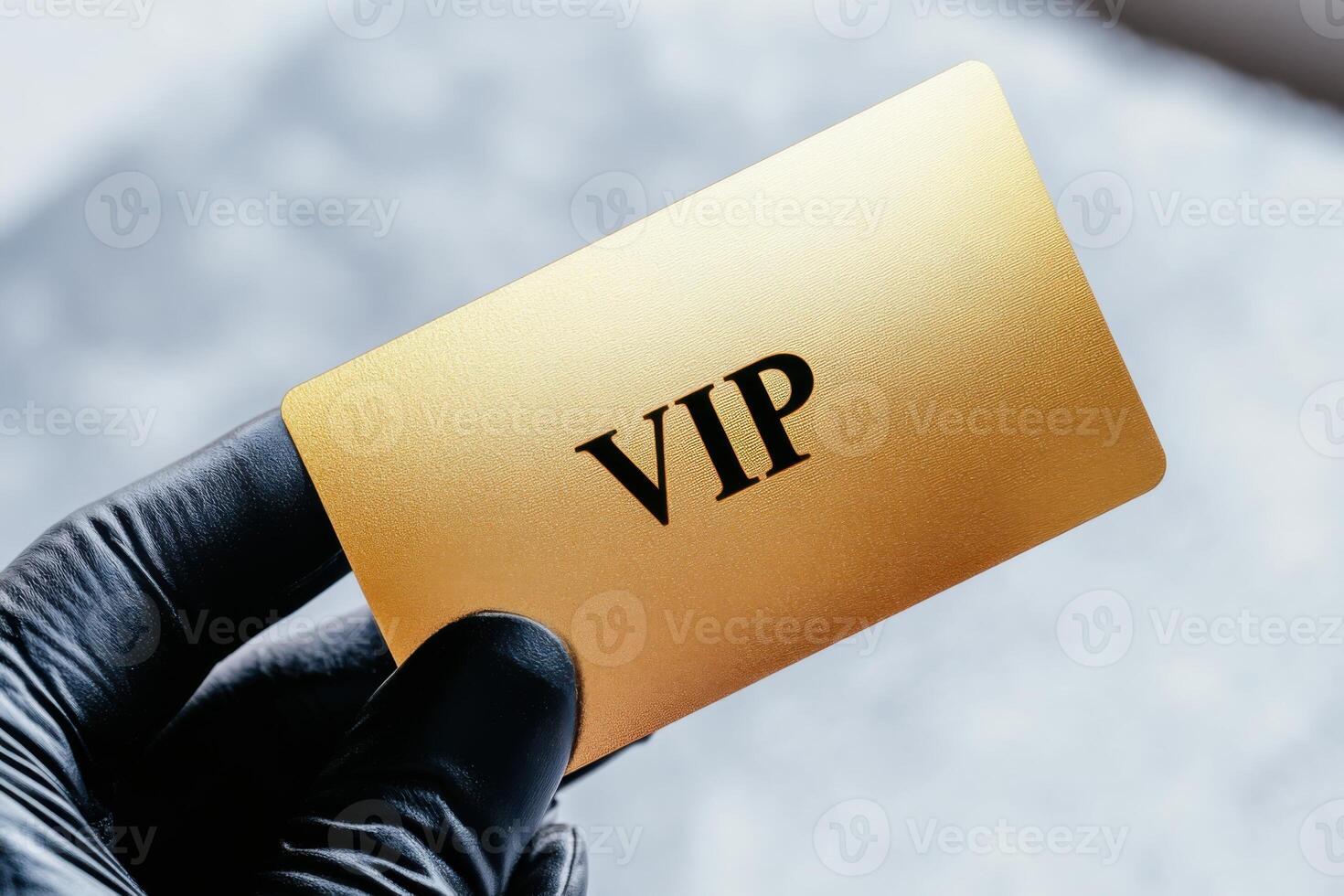 Elegant golden VIP membership card held in a black gloved hand, showcasing luxury and exclusivity in dramatic lighting photo