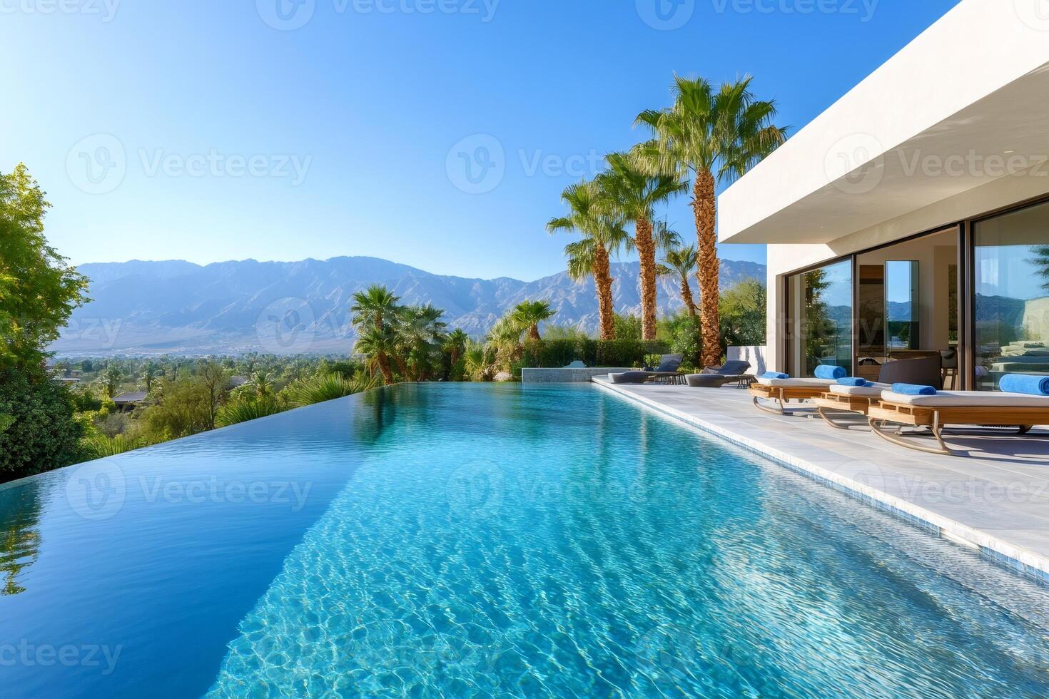 Luxurious infinity pool overlooking Palm Springs and mountains photo