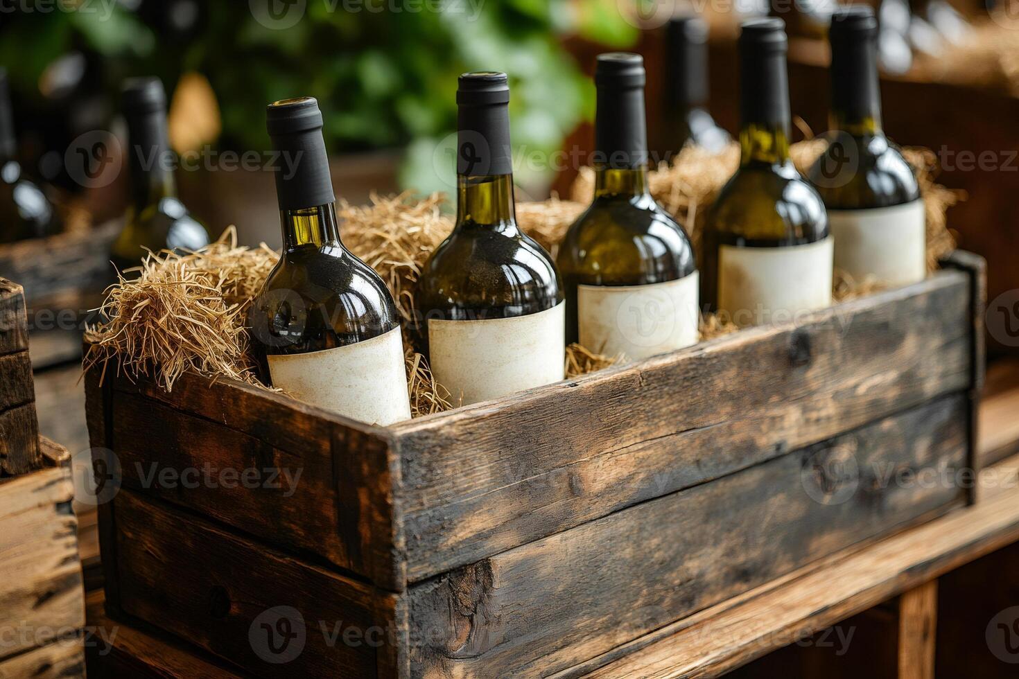 Wine bottles with blank labels resting in wooden crate with straw photo