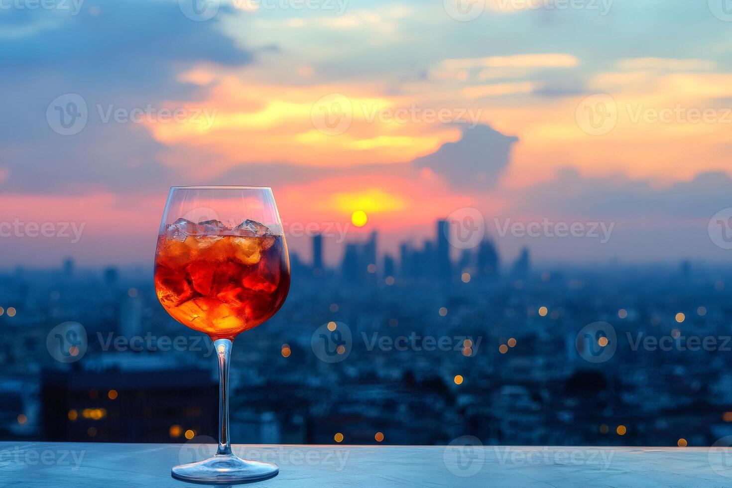 Enjoying a refreshing cocktail at sunset with breathtaking cityscape view photo