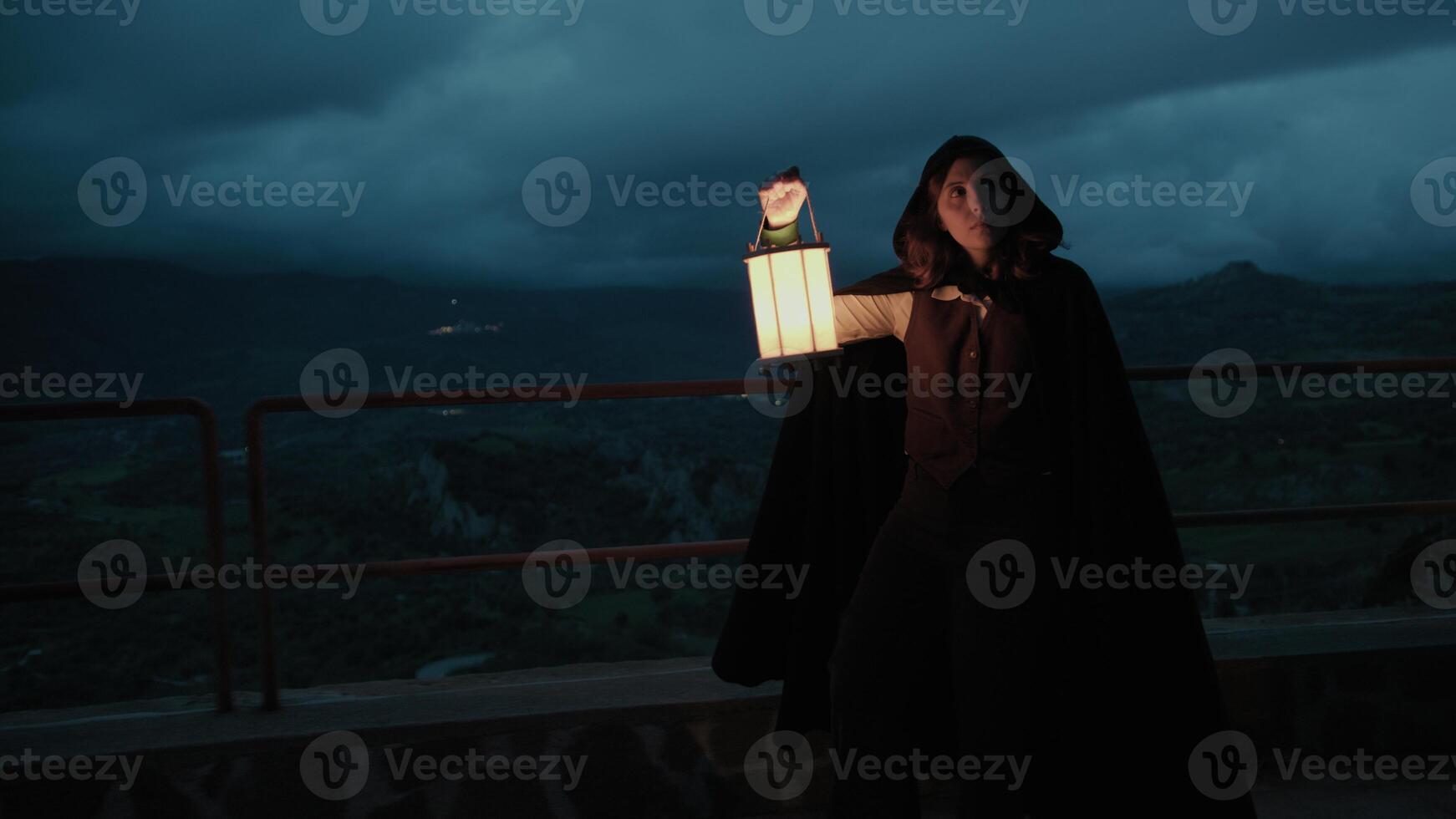 Woman Walks Mysteriously In A Square At Night Among The Darkness Of The Crime photo