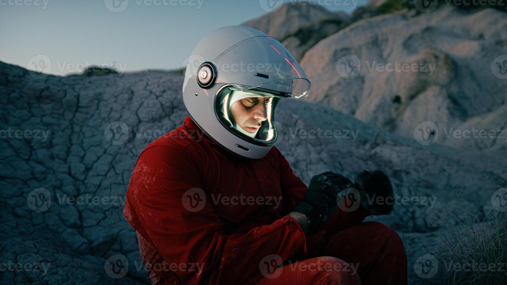 Astronaut Sits Tired On A Dry Rock At Night Before Sleeping Sad photo