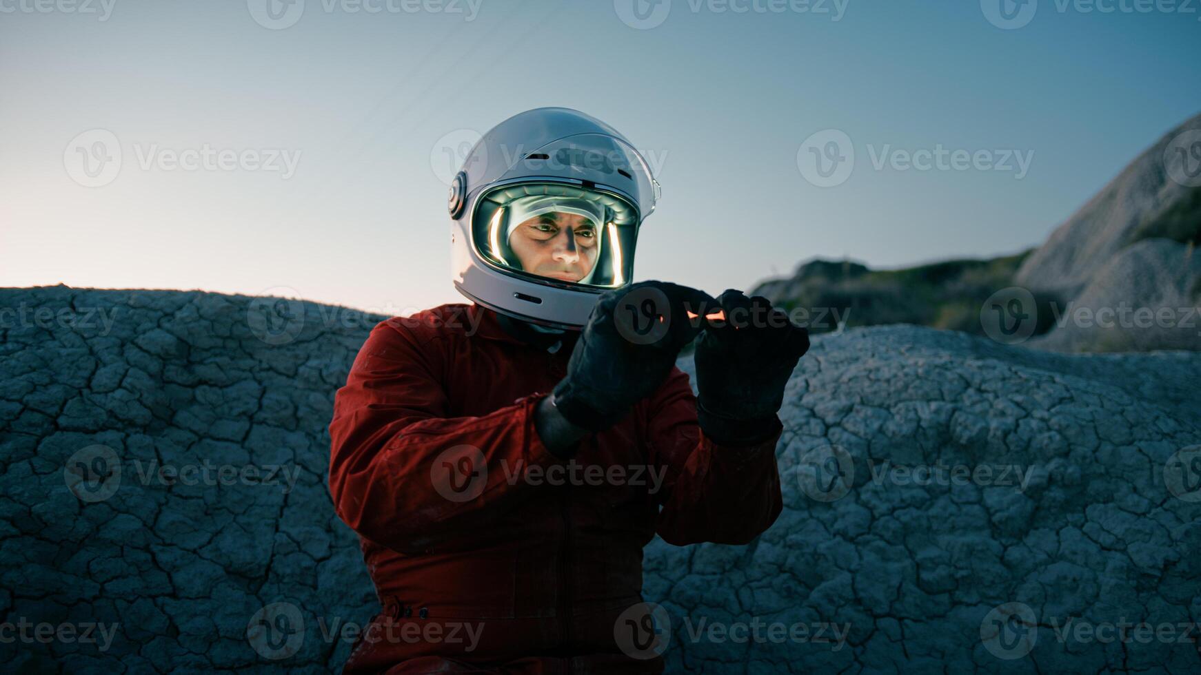 Astronaut Turns On An Orange Chemical Light To Illuminate The Night photo