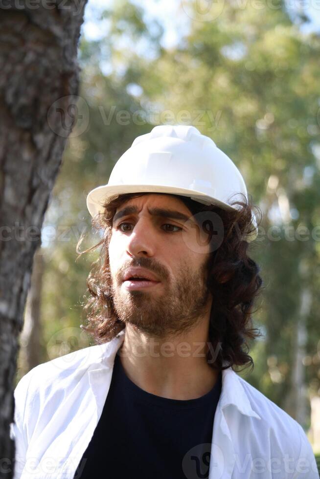 Scientist Fascinated By The Beautiful Trunk Of A Tree In The Countryside photo