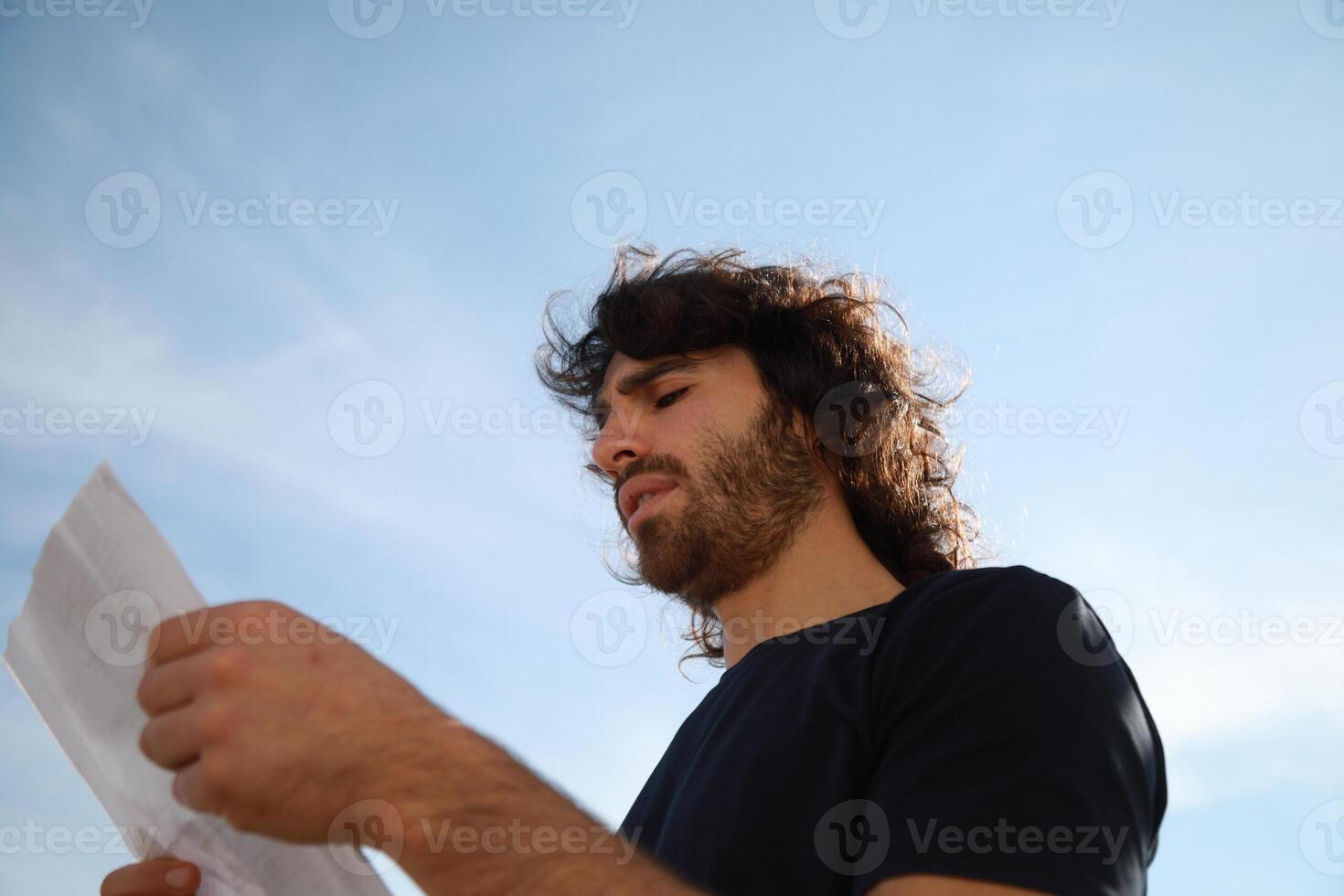 Scared Man Raises His Hands Before Receiving Theft From A Criminal In a Park photo