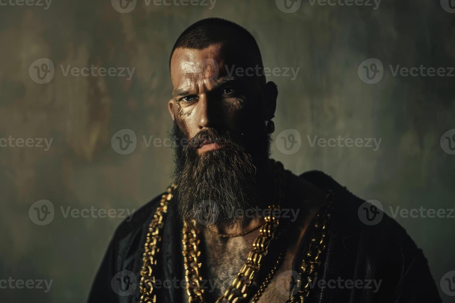 A bearded man with a gold chain and beard photo