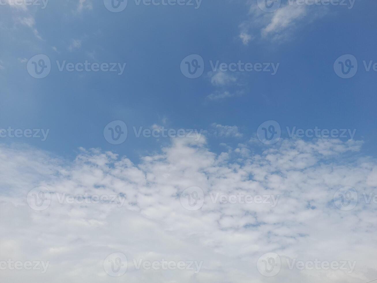 Beautiful grey clouds on sky background. Large bright soft fluffy clouds are cover the entire sky photo