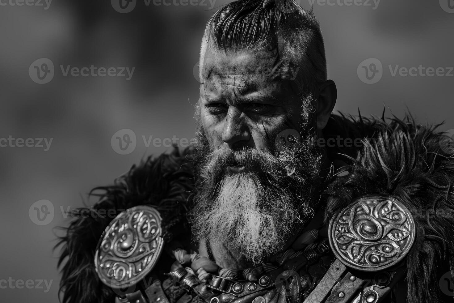 A black and white photo of a bearded man with a beard