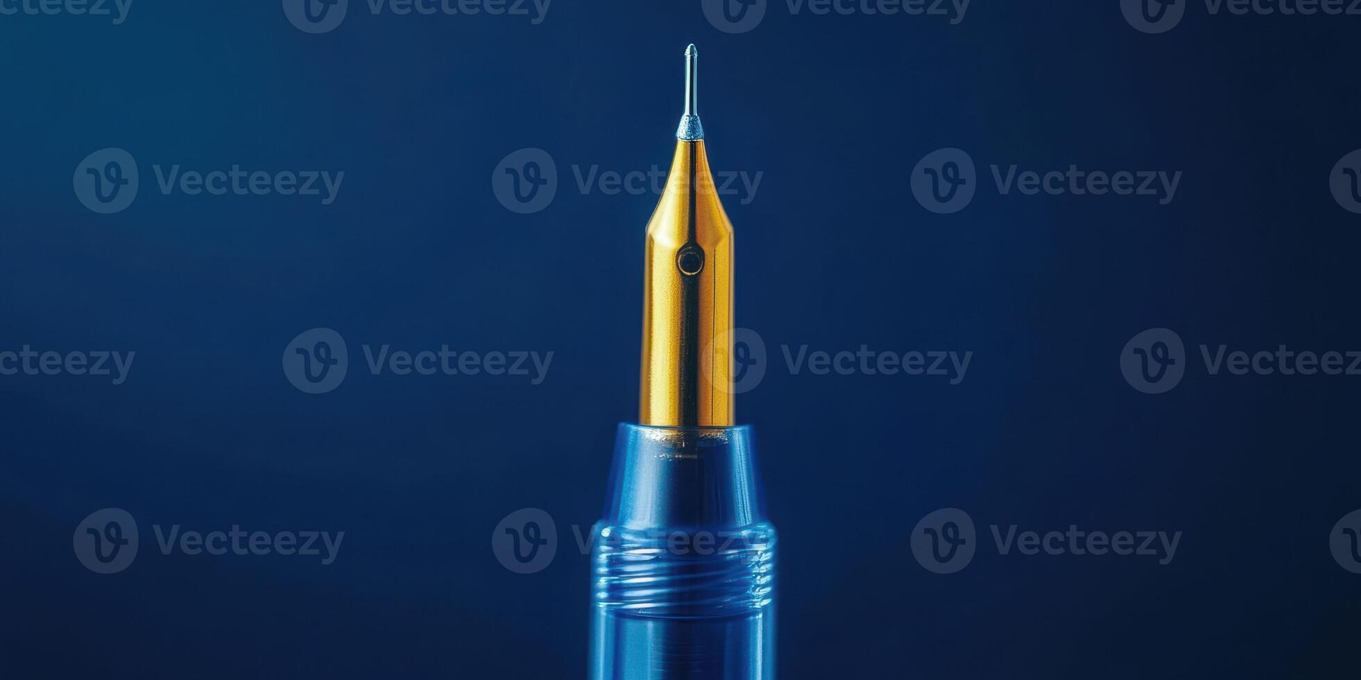 Fine fountain pen poised on a dark blue background showcasing its golden nib and polished body photo