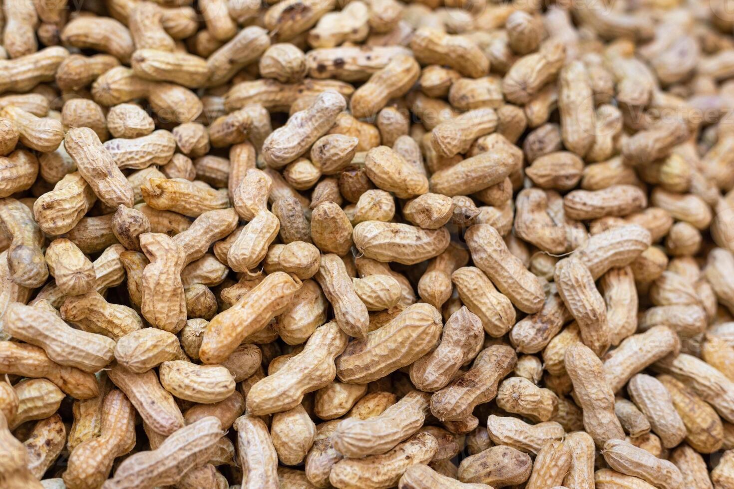 A pile of boiled local peanuts, high in protein and with many benefits, is a snack commonly sold in markets and street food. photo