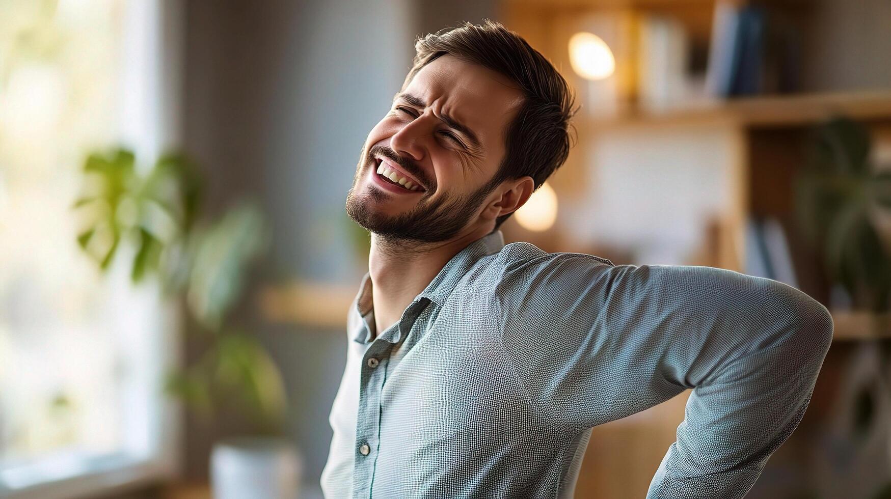 A man is smiling while having back pain photo