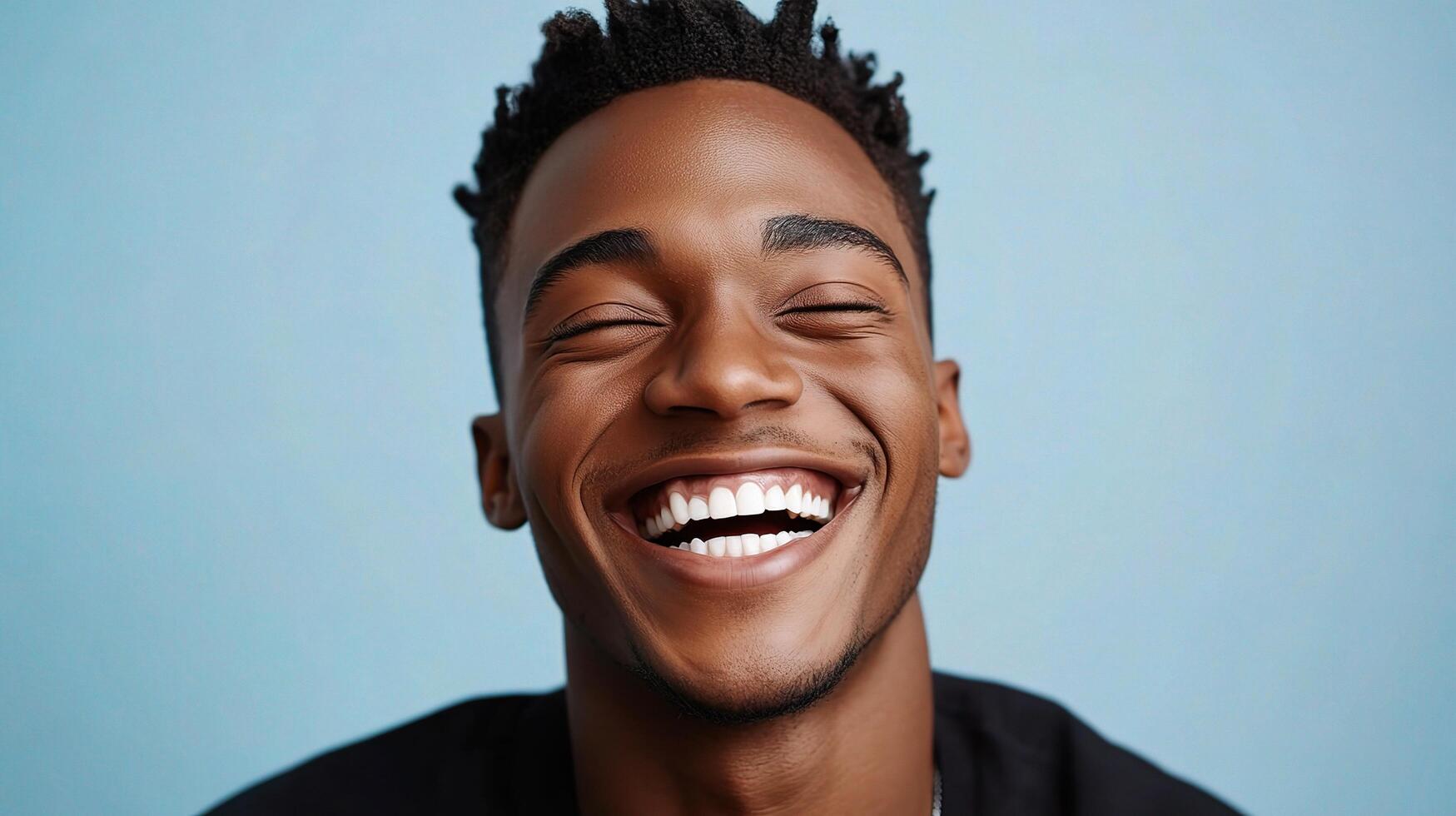 A man with dreadlocks is smiling photo