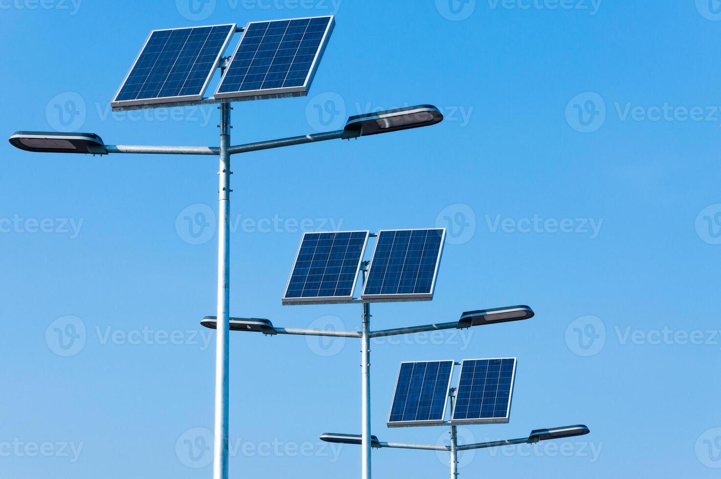 Solar panels installed on streetlights enhance energy efficiency in urban area during sunny day photo