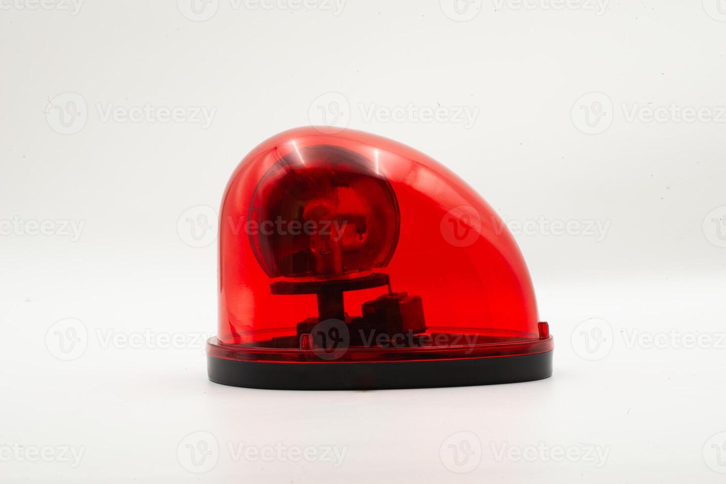Red emergency light positioned on a plain background showcasing its design and function clearly photo
