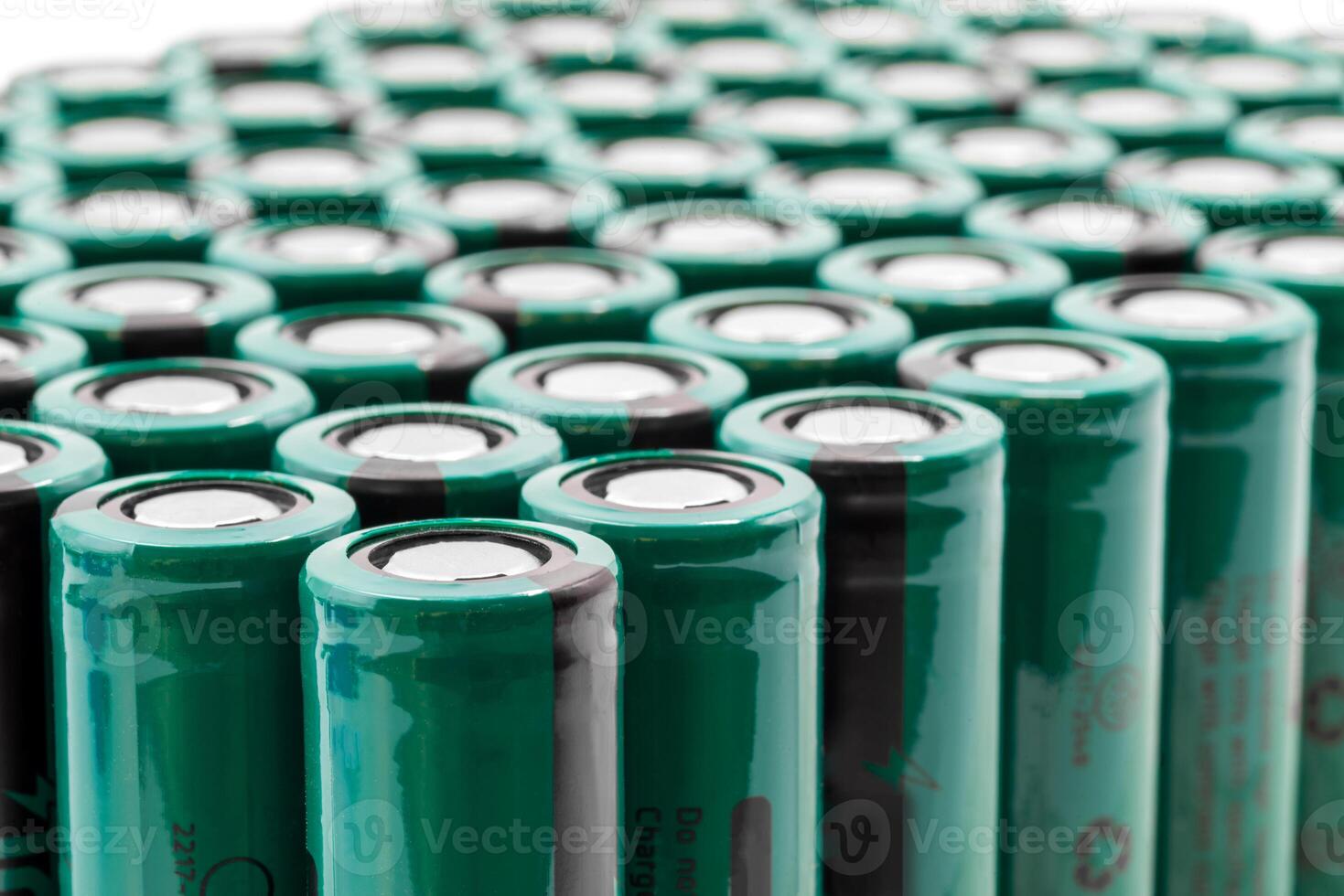 18650 model rechargeable lithium-ion batteries stacked closely together photo