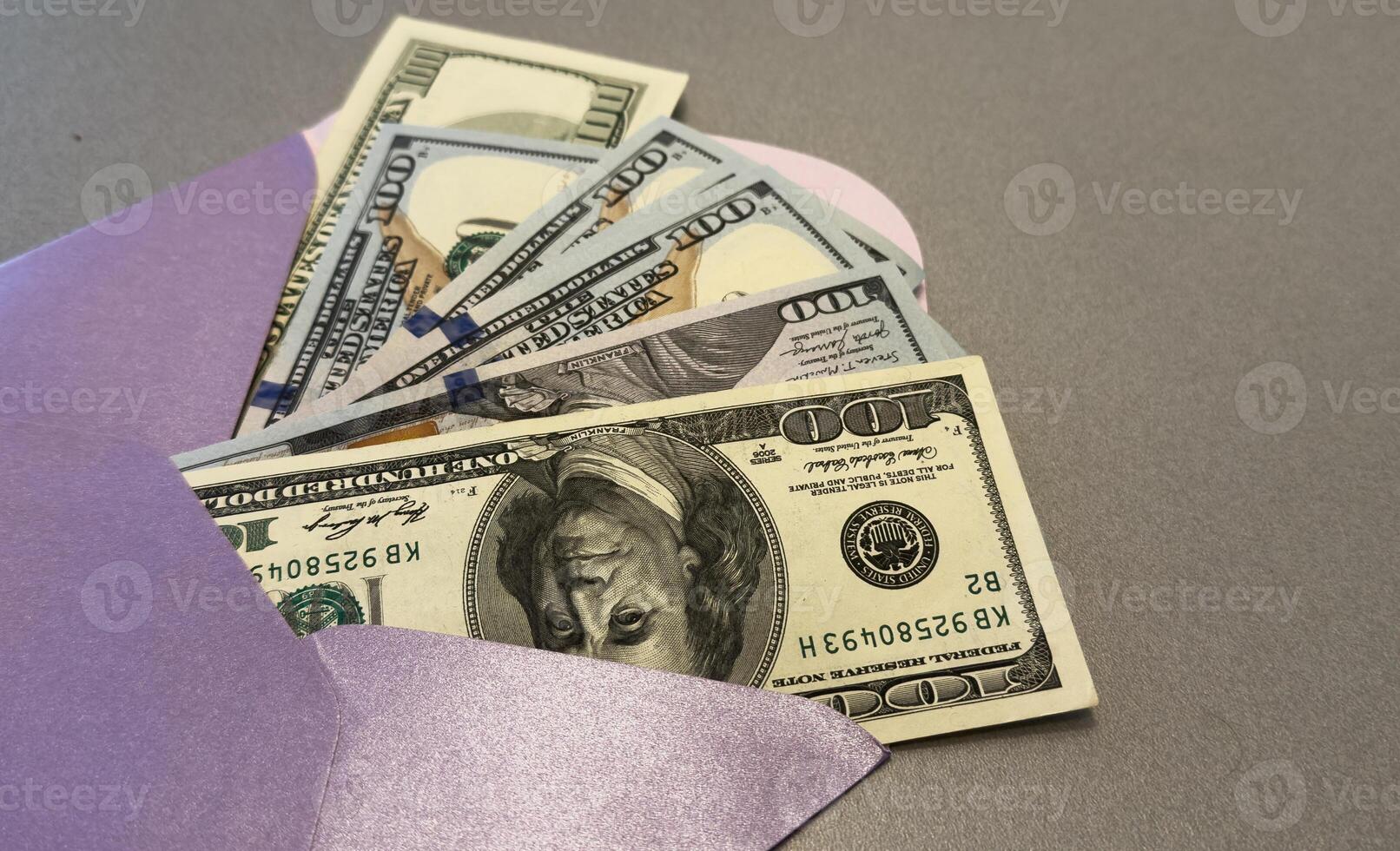 100 dollar bills in a envelope photo
